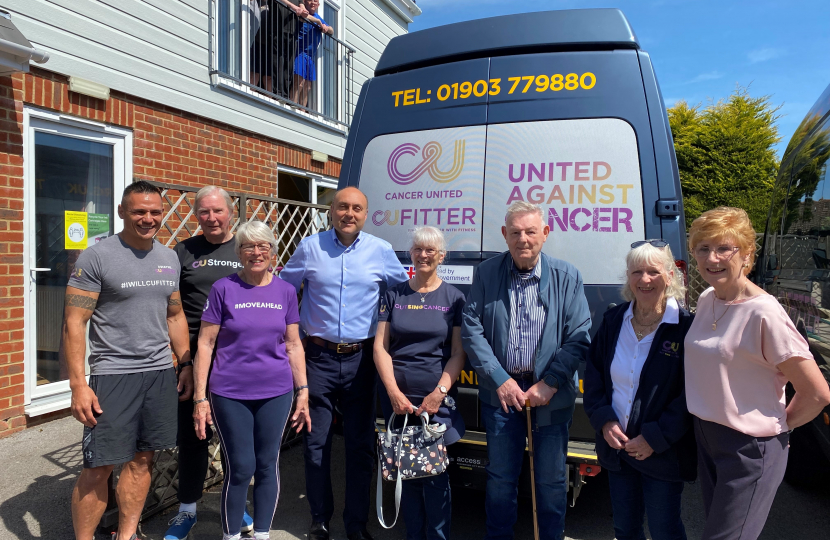 Andrew (centre), with Cancer United members and Dwaye Clevett (far left) and Jan Sheward (far right).