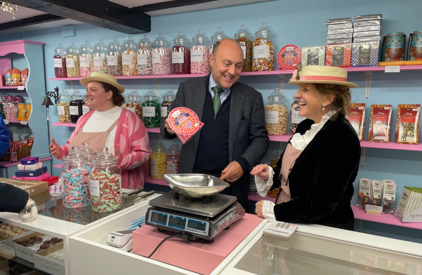 Andrew behind the sweet shop counter 