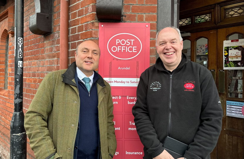 Andrew Griffith with Arundel Post Office postmaster Paul Money