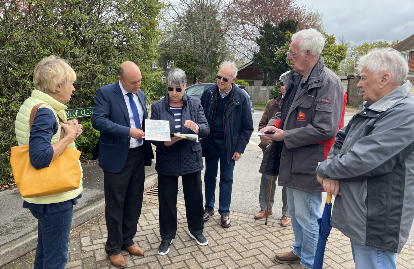 Andrew Griffith speaking to residents in Sayers Common about sewage issues