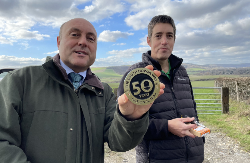 Andrew with Andy Gattiker showing South Downs Way 50th anniversary waymarker