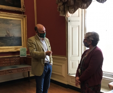 Andrew talking to a Petworth House volunteer Alison Miles.