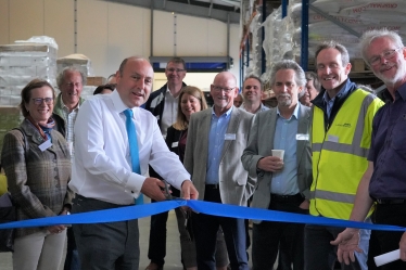 Andrew cutting the ribbon for Hepworth’s new smart tech lower-carbon warehouse.