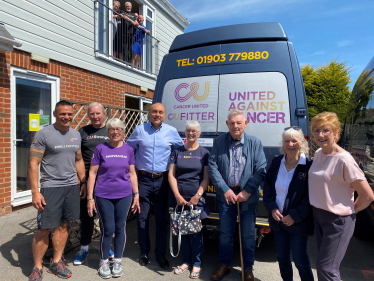 Andrew (centre), with Cancer United members and Dwaye Clevett (far left) and Jan Sheward (far right).