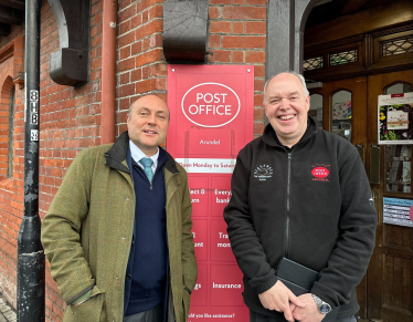 Andrew Griffith with Arundel Post Office postmaster Paul Money