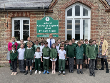 Andrew with headteacher Sarah Smith (far left) and children of Ashurst CofE Primary School