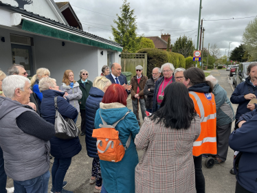 Andrew Griffith speaking to residents in Sayers Common about sewage issues