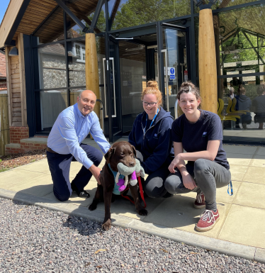 Andrew pictured with Bliss the Chocolate Lab, Sarah Carden and Susan Botherway.